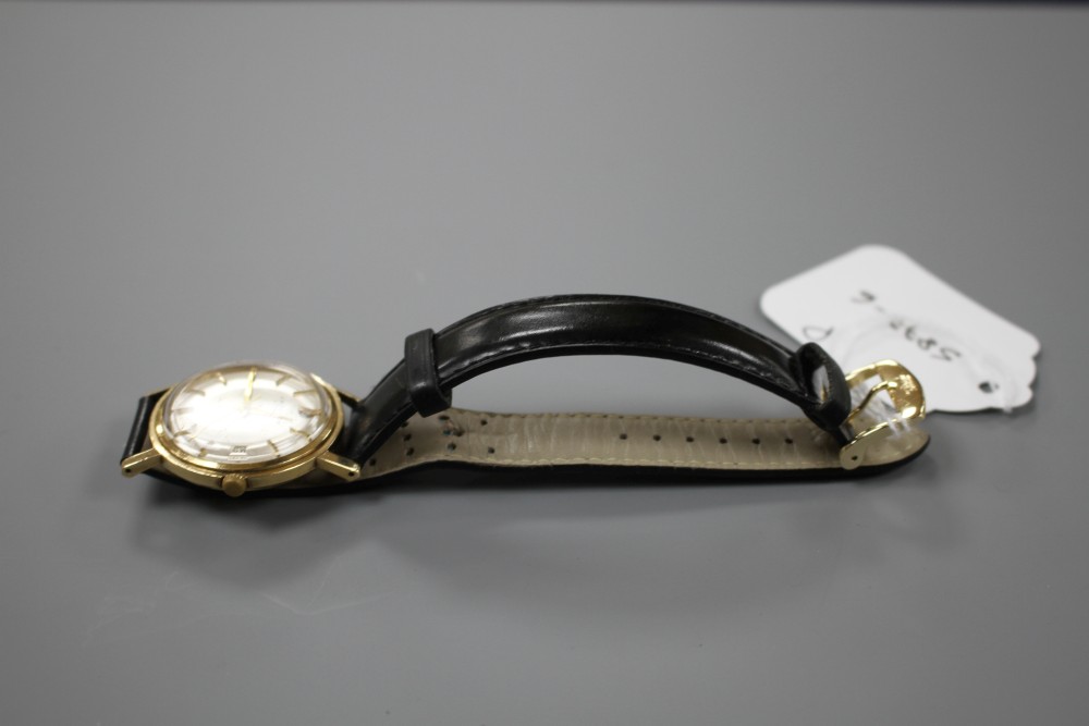 A gentlemans 1960s 9ct gold J.W. Benson automatic wrist watch, on later associated leather strap.